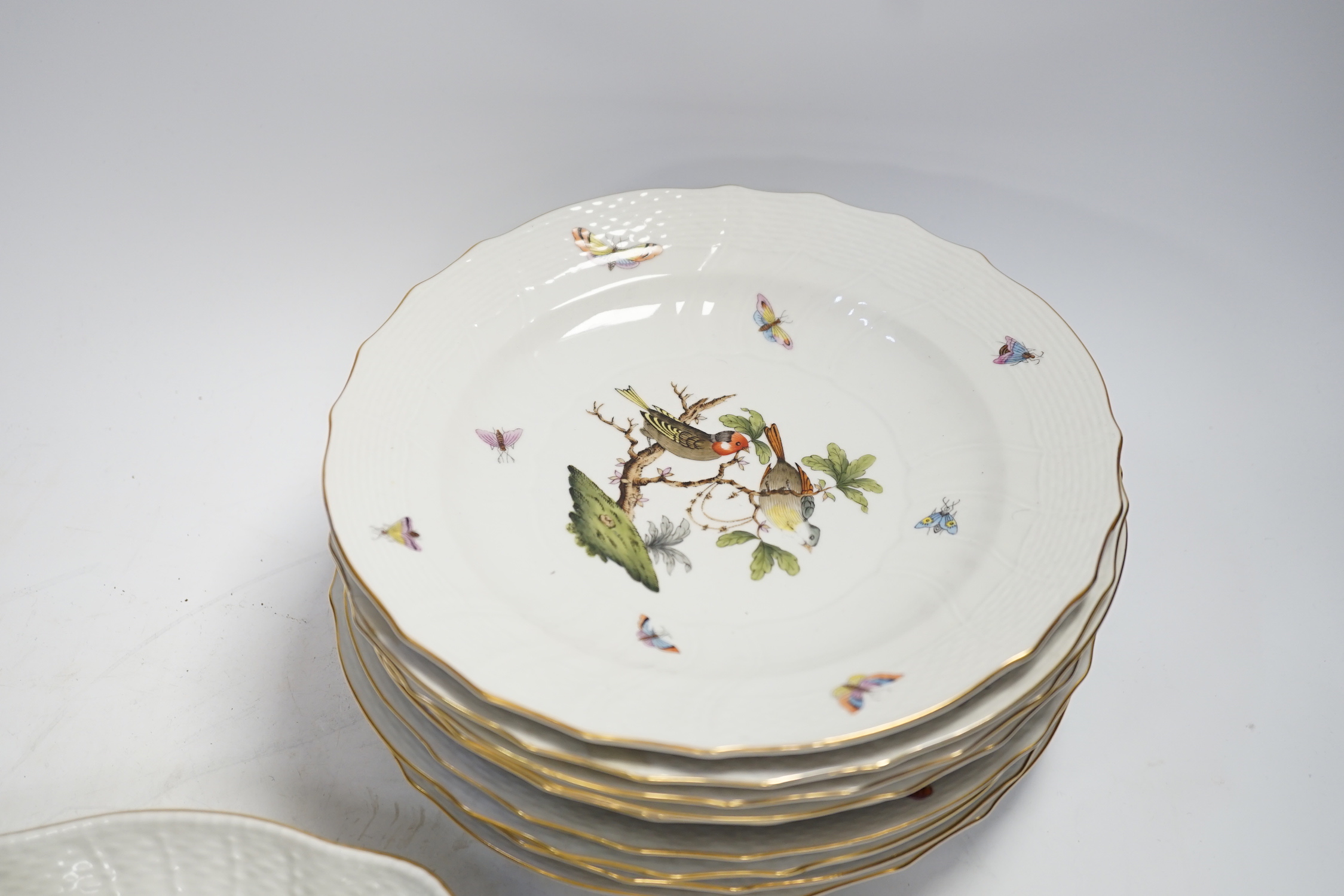 A Herend part dessert service comprising nine plates and two oval dishes together with two bowls, largest 26cm wide